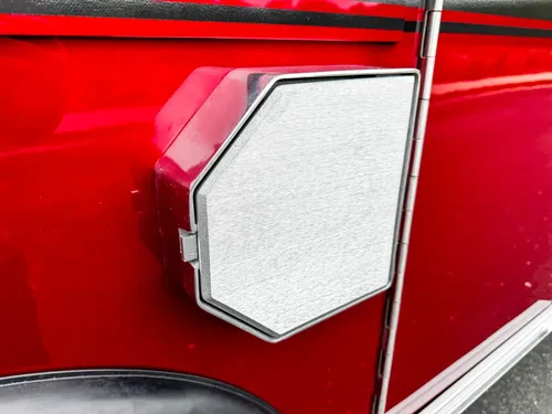Open side compartment view with shelf and interior light.